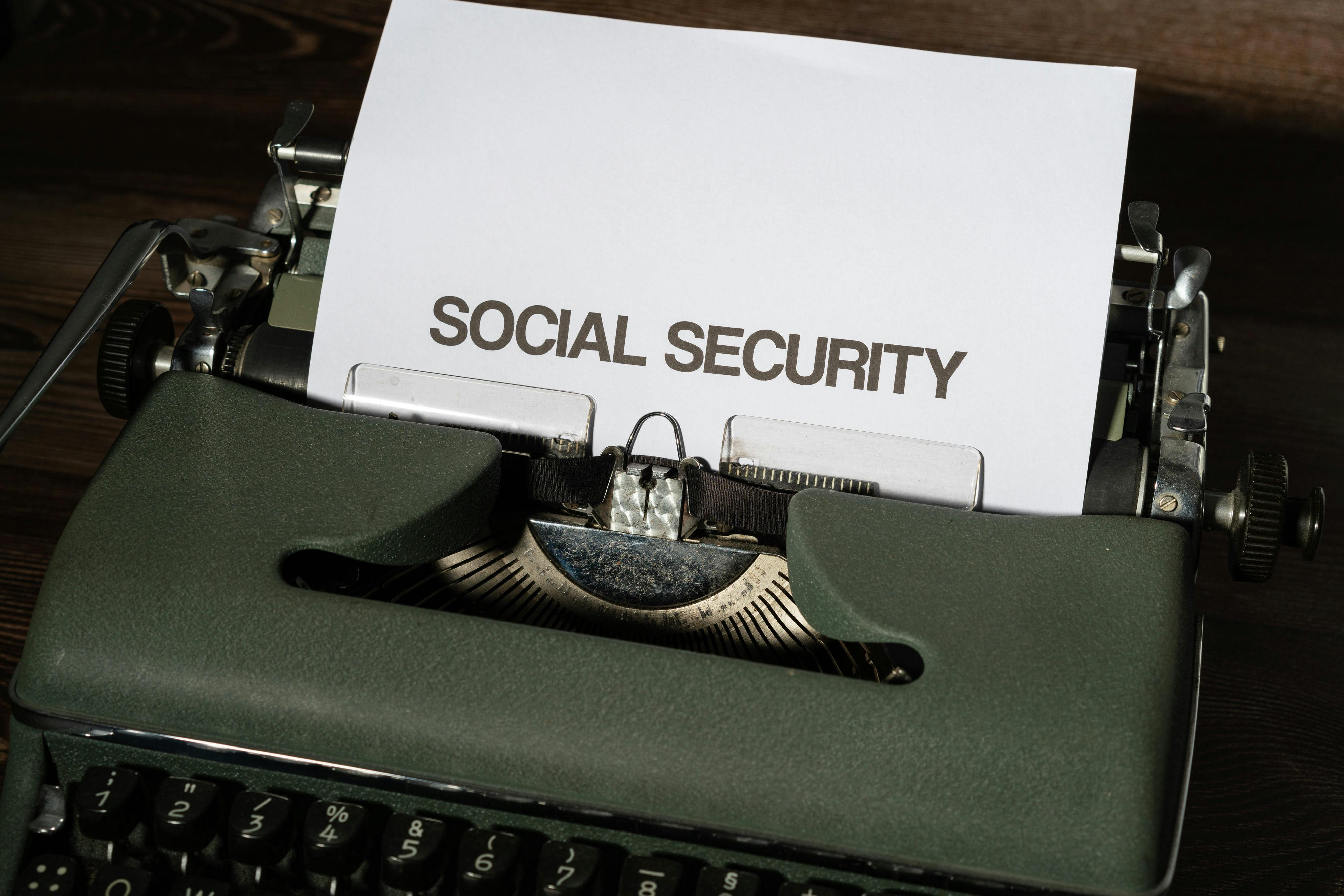 Typewriter with the words Social Security typed on paper, retirement planning strategy by Your Financial Genie